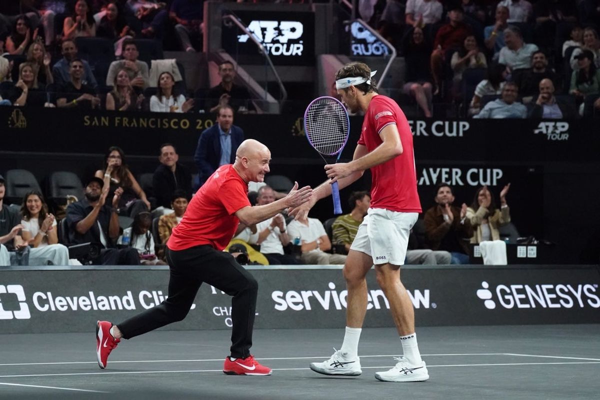 Sep 20, 2025; San Francisco, CA, USA;  Team World player Taylor Fritz celebrates with captain Andre Agassi at the Laver Cup at Chase Center. Mandatory Credit: David Gonzales-Imagn Images