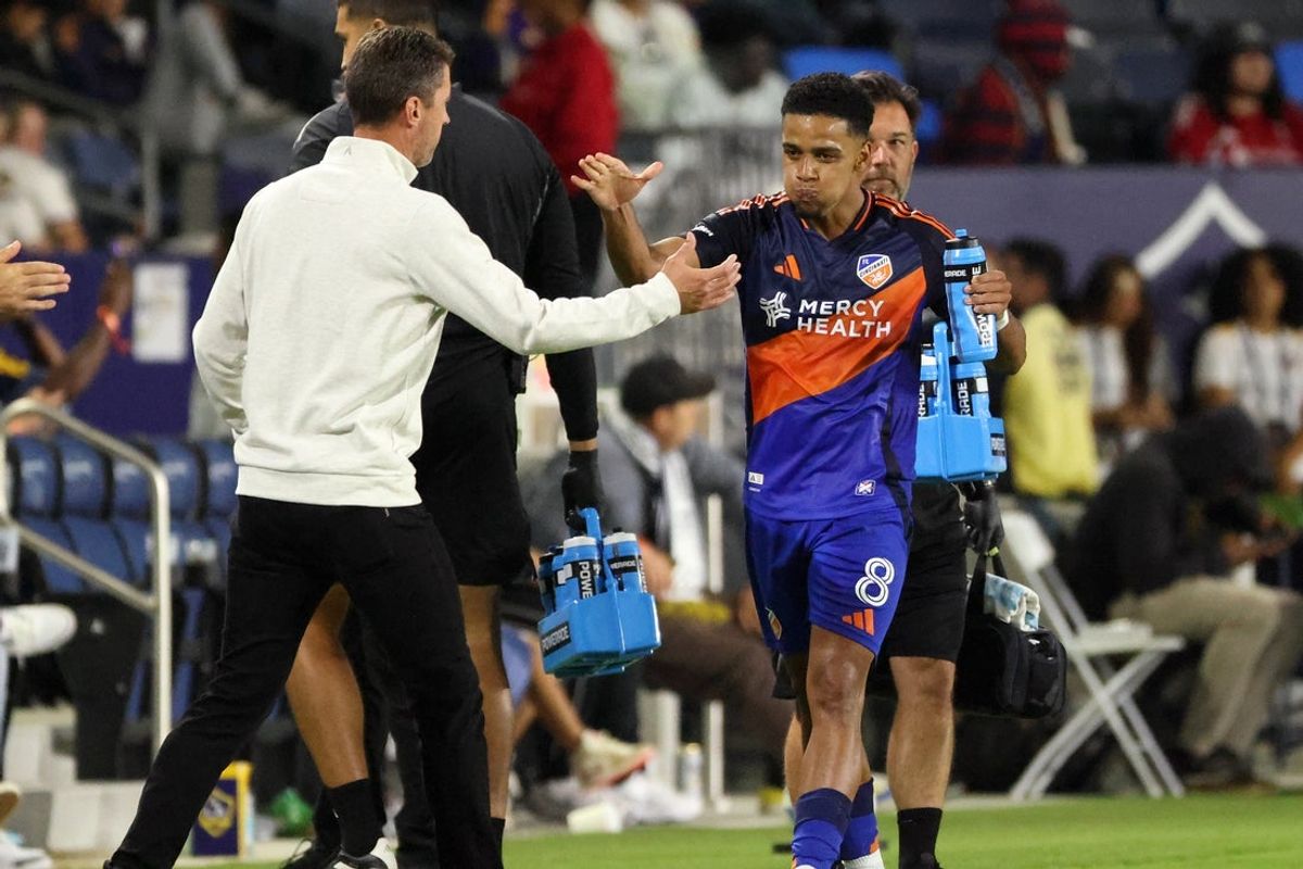 Sep 20, 2025; Carson, California, USA;  FC Cincinnati forward Brenner (8) is congratulated by head coach Pat Noonan after scoring a goal during the second half against the LA Galaxy at Dignity Health Sports Park. Mandatory Credit: Kiyoshi Mio-Imagn Images
