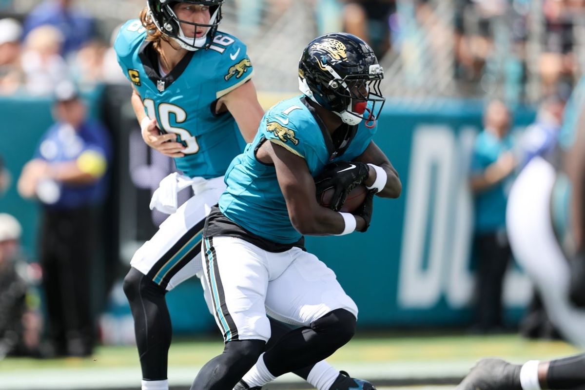 Sep 21, 2025; Jacksonville, Florida, USA; Jacksonville Jaguars running back Travis Etienne (1) receives a handoff during the first quarter against the Houston Texans at EverBank Stadium. Mandatory Credit: Morgan Tencza-Imagn Images