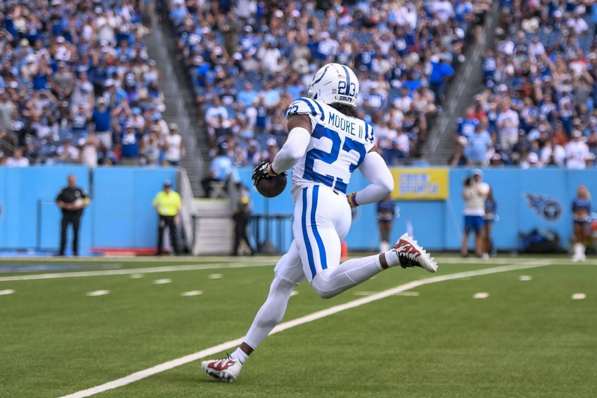 Sep 21, 2025; Nashville, Tennessee, USA; Indianapolis Colts cornerback Kenny Moore II (23) intercepts a pass for a pick six during the first quarter at Nissan Stadium. Mandatory Credit: Steve Roberts-Imagn Images