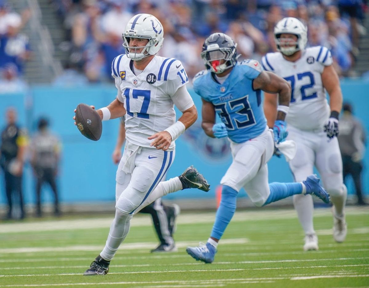 Indianapolis Colts quarterback Daniel Jones (17) runs for a first down against the Tennessee Titans during the first quarter at Nissan Stadium in Nashville, Tenn., Sunday, Sept. 14, 2025.