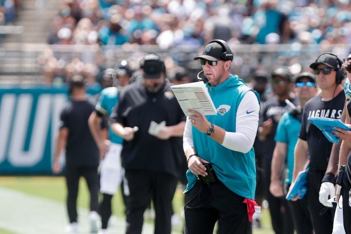 Sep 21, 2025; Jacksonville, Florida, USA; Jacksonville Jaguars head coach Liam Coen reads a play during the second quarter against the Houston Texans at EverBank Stadium. Mandatory Credit: Travis Register-Imagn Images