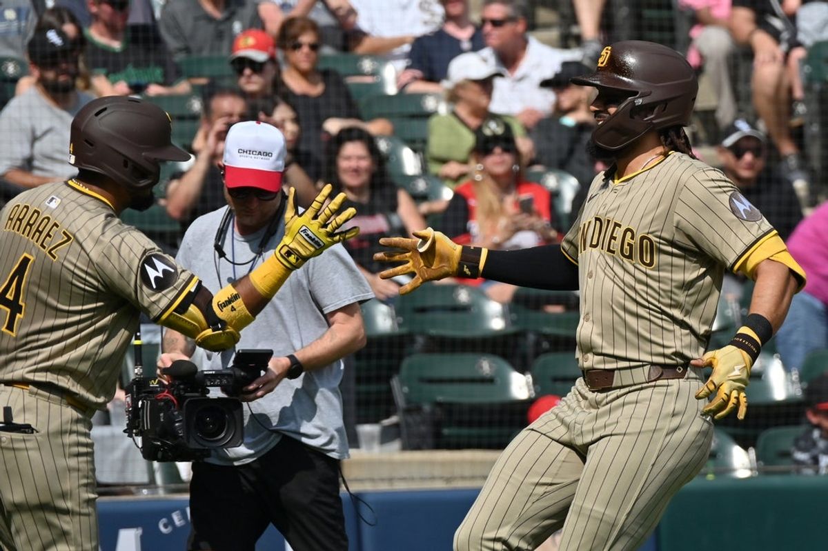 Sep 21, 2025; Chicago, Illinois, USA; San Diego Padres right fielder Fernando Tatis Jr. (23) celebrates his solo home run with first baseman Luis Arraez (4) against the Chicago White Sox during the third inning at Rate Field. Mandatory Credit: Patrick Gorski-Imagn Images