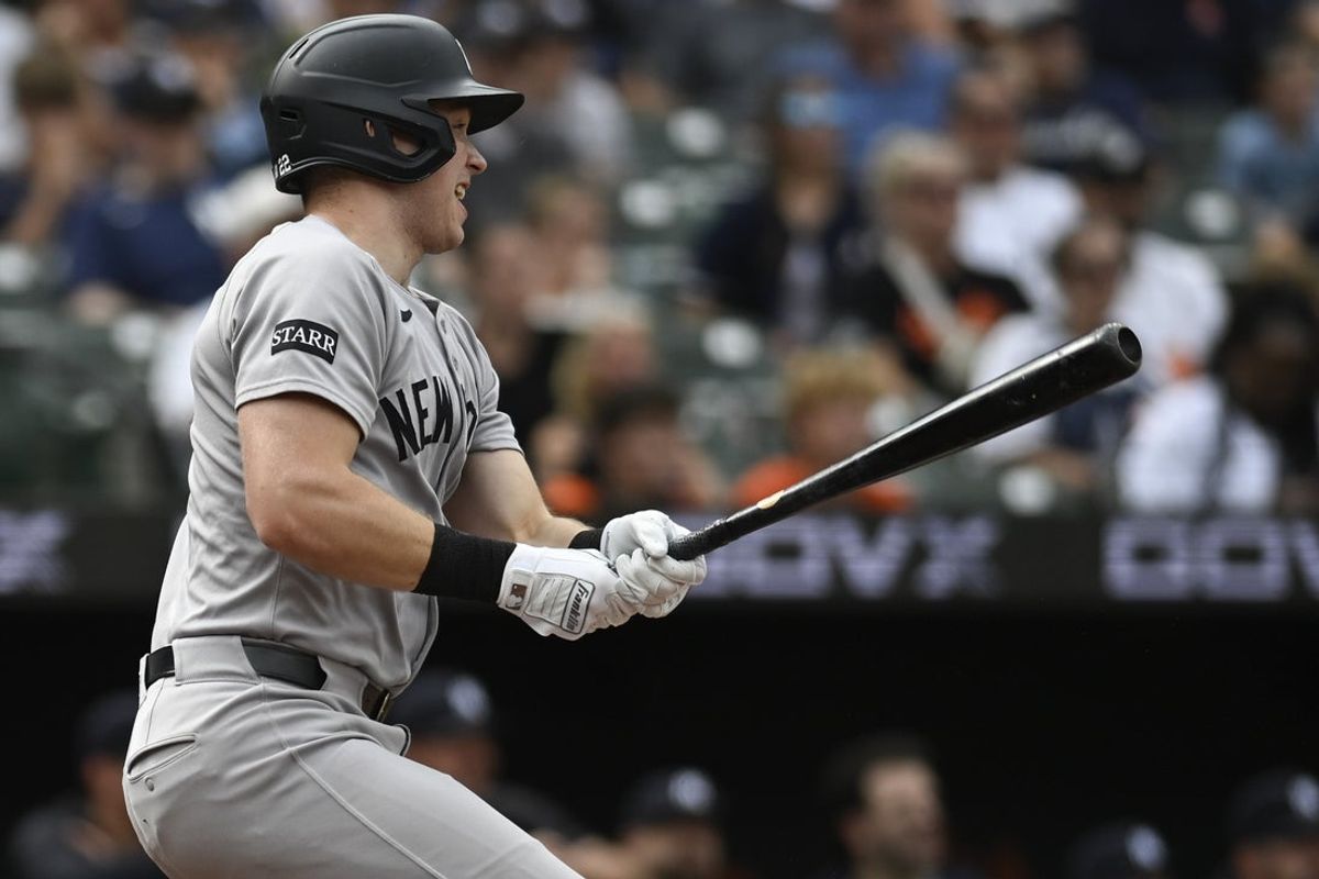 Sep 21, 2025; Baltimore, Maryland, USA;  New York Yankees first base Ben Rice (22) swings through sixth inning rbi single against the Baltimore Orioles at Oriole Park at Camden Yards. Mandatory Credit: Tommy Gilligan-Imagn Images