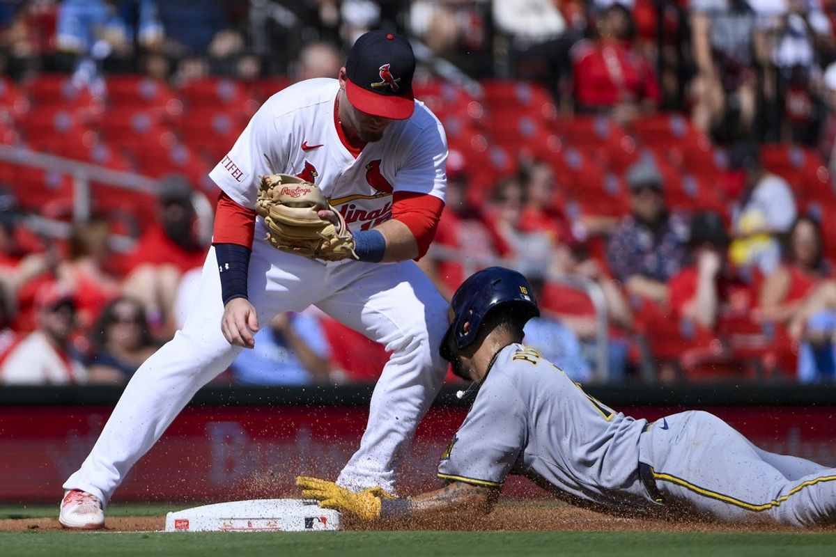 Sep 21, 2025; St. Louis, Missouri, USA; Milwaukee Brewers center fielder Blake Perkins (16) slides into the knee of St. Louis Cardinals third baseman Nolan Gorman (16) as he steals third base during the third inning at Busch Stadium. Mandatory Credit: Jeff Curry-Imagn Images