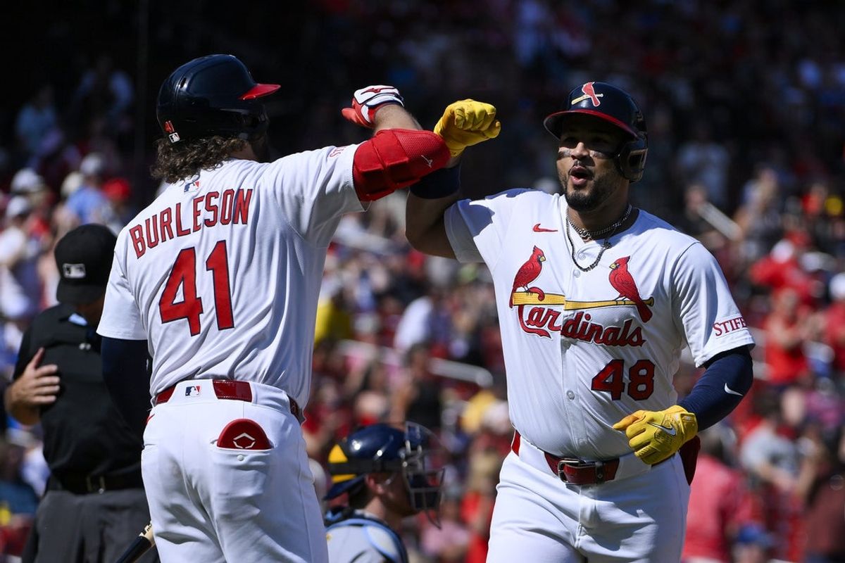 Sep 21, 2025; St. Louis, Missouri, USA; St. Louis Cardinals designated hitter Ivan Herrera (48) celebrates with first baseman Alec Burleson (41) after hitting a two run home run against the Milwaukee Brewers during the third inning at Busch Stadium. Mandatory Credit: Jeff Curry-Imagn Images
