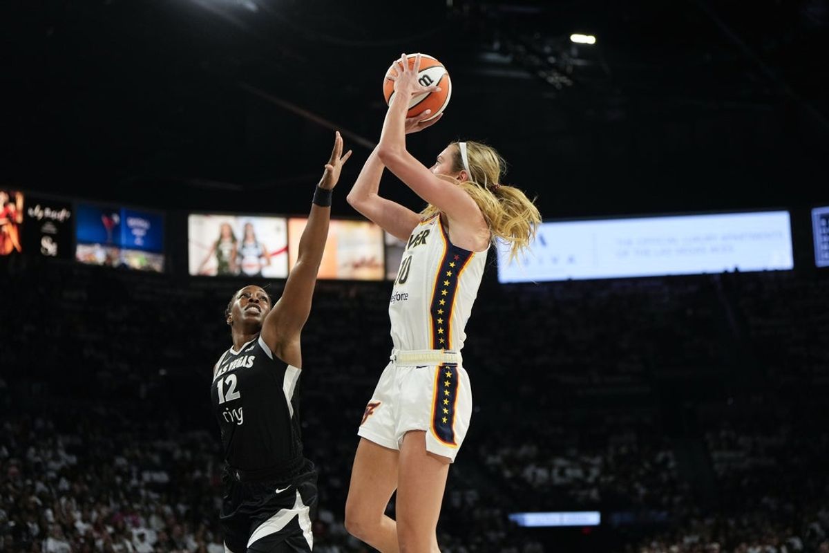 Sep 21, 2025; Las Vegas, Nevada, USA; Indiana Fever guard Lexie Hull (10) shoots the ball against Las Vegas Aces guard Chelsea Gray (12) during the first quarter in game one of the second round for the 2025 WNBA Playoffs at Michelob Ultra Arena. Mandatory Credit: Lucas Peltier-Imagn Images