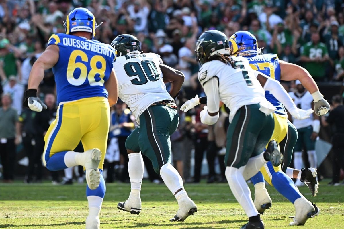 Sep 21, 2025; Philadelphia, Pennsylvania, USA; Los Angeles Rams kicker Joshua Karty (not pictured) has a field goal blocked by Philadelphia Eagles cornerback Kelee Ringo (7) and returned for a touchdown by defensive tackle Jordan Davis (90) during he second half at Lincoln Financial Field. Mandatory Credit: Eric Hartline-Imagn Images
