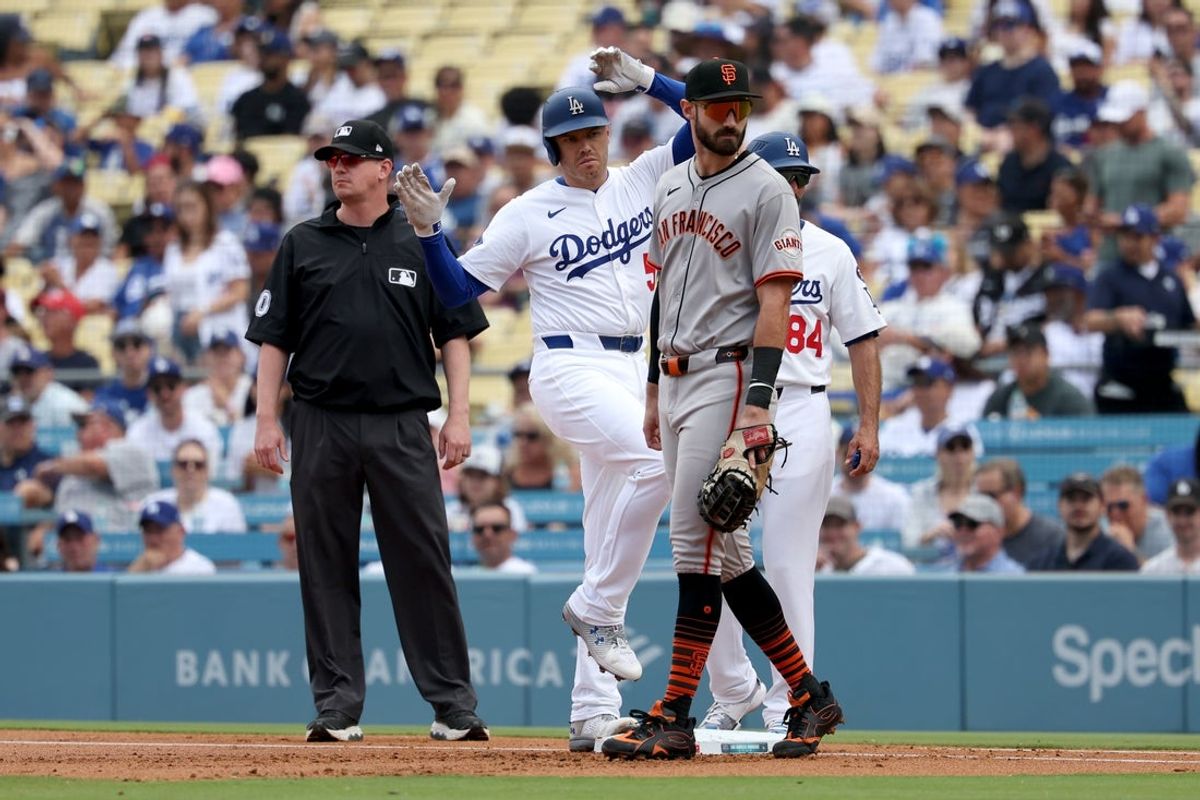 Sep 21, 2025; Los Angeles, California, USA; Los Angeles Dodgers first base Freddie Freeman (5) reacts after hitting a single in the first inning against the San Francisco Giants at Dodger Stadium. Mandatory Credit: Kiyoshi Mio-Imagn Images