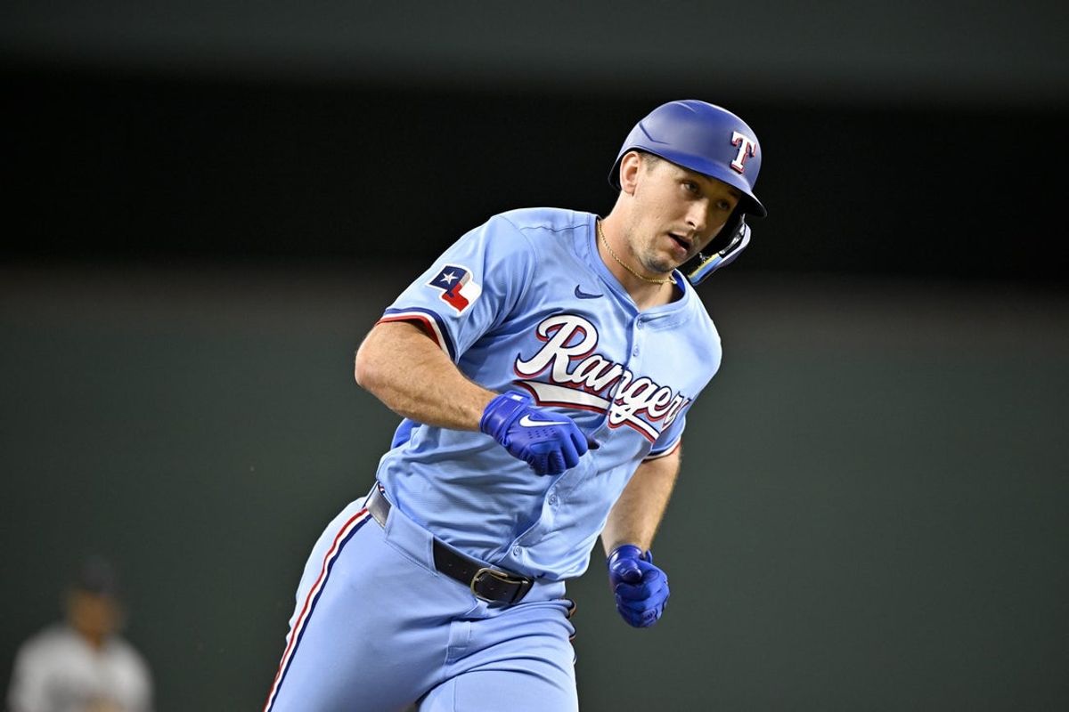 Sep 21, 2025; Arlington, Texas, USA; Texas Rangers left fielder Wyatt Langford (36) rounds the bases after he hits a home run against the Miami Marlins during the sixth inning at Globe Life Field. Mandatory Credit: Jerome Miron-Imagn Images