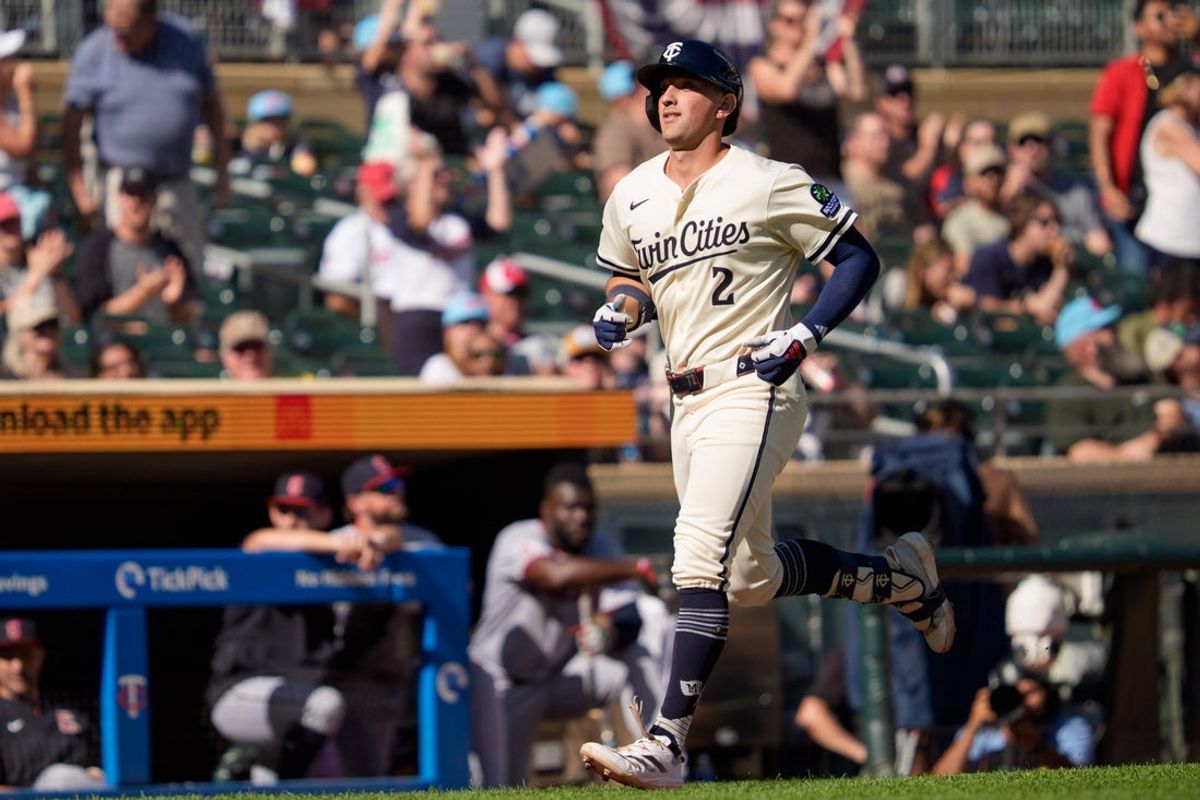 Sep 21, 2025; Minneapolis, Minnesota, USA; Minnesota Twins third base Brooks Lee (2) rounds third base for home after hitting a two run home run against Cleveland Guardians pitcher Matt Festa (52) in the sixth inning at Target Field. Mandatory Credit: Matt Blewett-Imagn Images