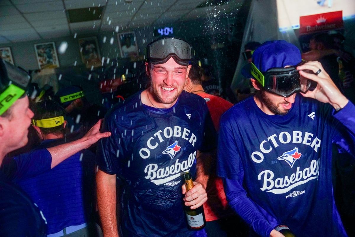 Sep 21, 2025; Kansas City, Missouri, USA; Toronto Blue Jays starting pitcher Trey Yesavage (39) and team mates  celebrate in the locker room after the win over the Kansas City Royals at Kauffman Stadium. Mandatory Credit: Denny Medley-Imagn Images