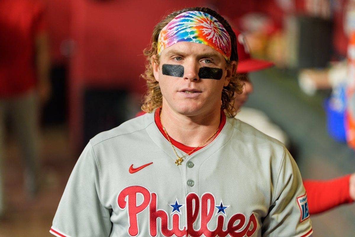 Sep 21, 2025; Phoenix, Arizona, USA; Philadelphia Phillies outfielder Harrison Bader (2) readies hiimself in the dugout before the start of a game against the Arizona Diamondbacks at Chase Field. Mandatory Credit: Allan Henry-Imagn Images