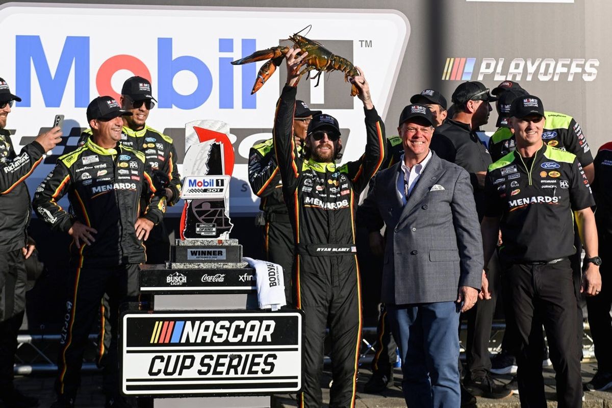 Sep 21, 2025; Loudon, New Hampshire, USA; NASCAR Cup Series driver Ryan Blaney (12) poses with 'Loudon the Lobster' after winning the Mobil 1 301 at New Hampshire Motor Speedway. Mandatory Credit: Eric Canha-Imagn Images