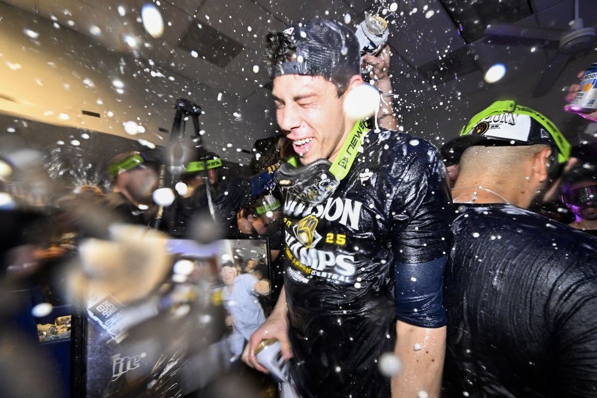 Sep 21, 2025; St. Louis, Missouri, USA; Milwaukee Brewers left fielder Christian Yelich (22) is showered with beer and champagne after the Brewers clinched the 2025 National League Central Division Championship following a game against the St. Louis Cardinals at Busch Stadium. Mandatory Credit: Jeff Curry-Imagn Images