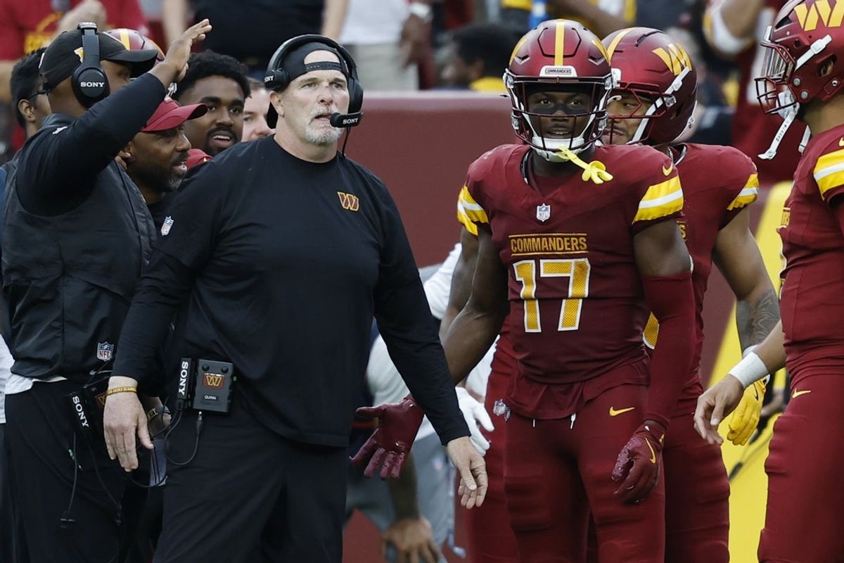 Sep 21, 2025; Landover, Maryland, USA; Washington Commanders head coach Dan Quinn (L) stands with Commanders wide receiver Terry McLaurin (17) on the sidelines against the Las Vegas Raiders during the third quarter at Northwest Stadium. Mandatory Credit: Geoff Burke-Imagn Images