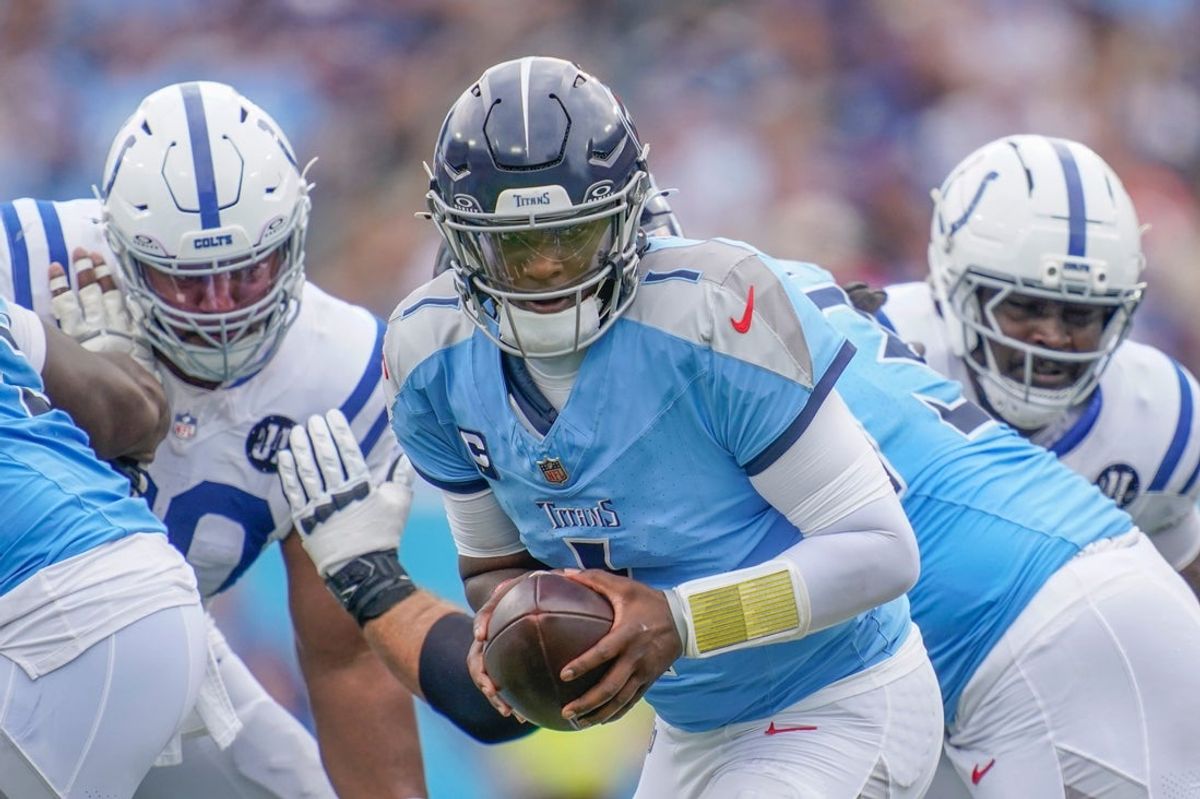 Tennessee Titans quarterback Cam Ward (1) maneuvers against the Indianapolis Colts during the first quarter at Nissan Stadium in Nashville, Tenn., Sunday, Sept. 21, 2025.