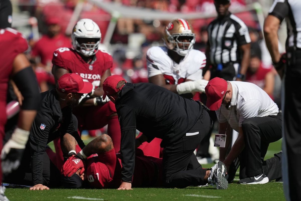 Sep 21, 2025; Santa Clara, California, USA; Arizona Cardinals running back James Conner (6) is tended to by medical personal after being tackled during the second half against the San Francisco 49ers at Levi's Stadium. Mandatory Credit: Cary Edmondson-Imagn Images