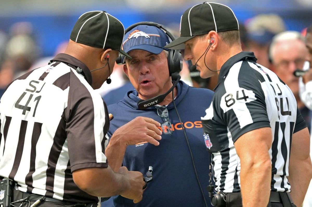 Sep 21, 2025; Inglewood, California, USA;  Denver Broncos head coach Sean Payton talks with with side judge Boris Cheek (41) and line judge Mark Steinkerchner (84) in the first half against the Los Angeles Chargers at SoFi Stadium. Mandatory Credit: Jayne Kamin-Oncea-Imagn Images