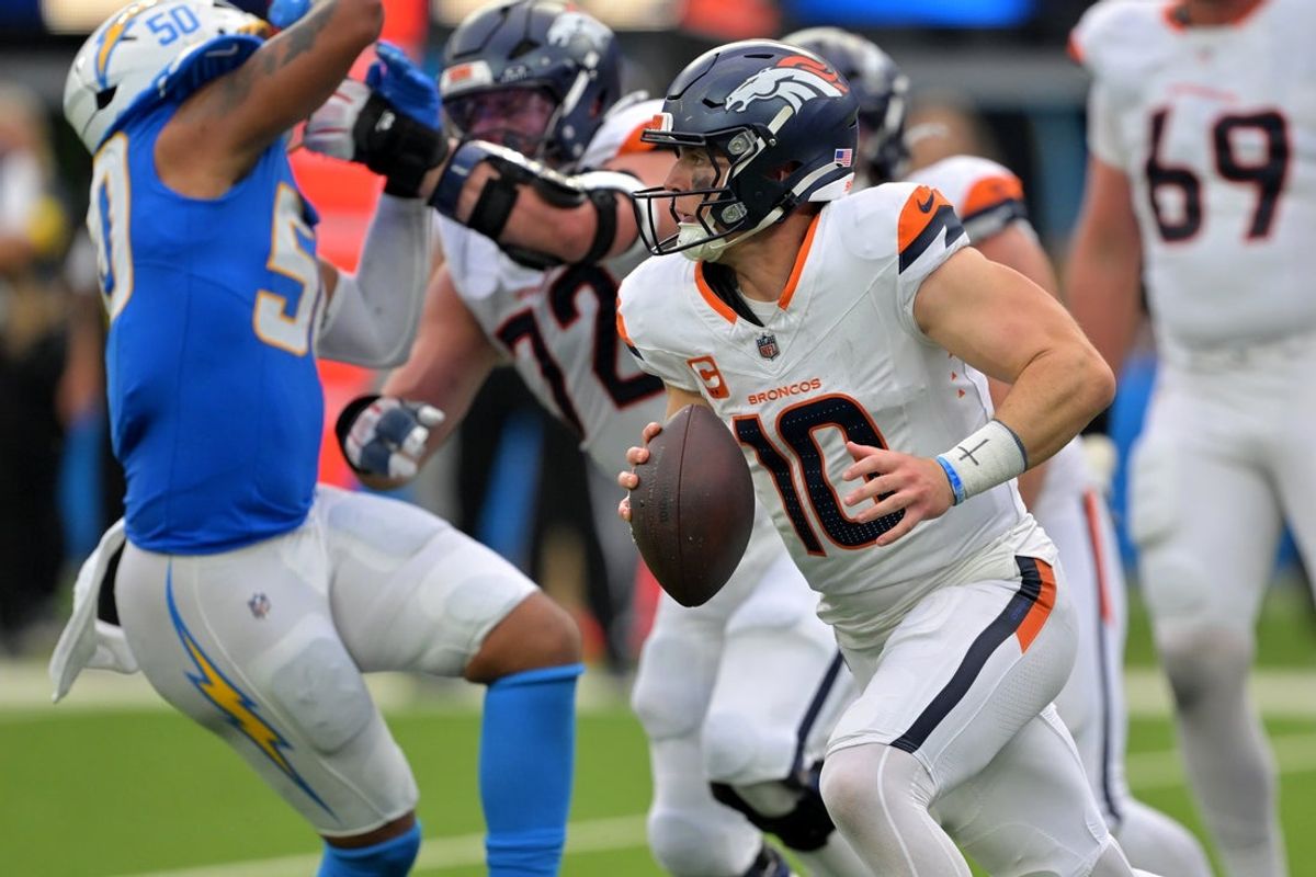 Sep 21, 2025; Inglewood, California, USA;  Denver Broncos quarterback Bo Nix (10) scrambles in the pocket in the second half against the Los Angeles Chargers at SoFi Stadium. Mandatory Credit: Jayne Kamin-Oncea-Imagn Images