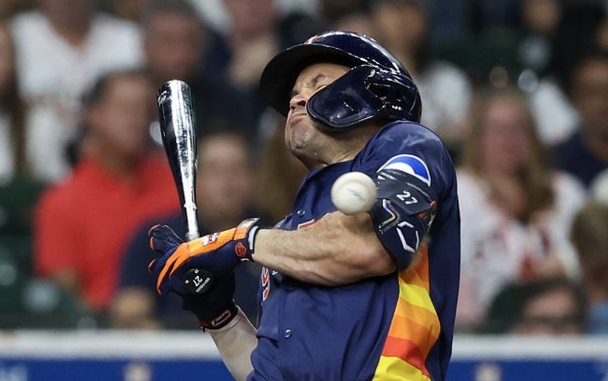 Sep 21, 2025; Houston, Texas, USA; Houston Astros second baseman Jose Altuve (27) is hit by a pitch against the Seattle Mariners in the fifth inning at Daikin Park. Mandatory Credit: Thomas Shea-Imagn Images