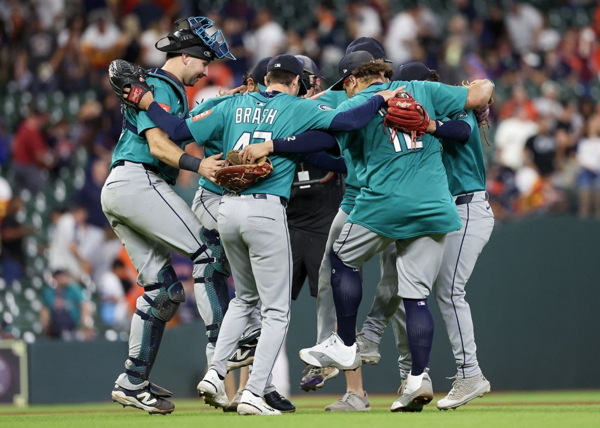 Sep 21, 2025; Houston, Texas, USA; Seattle Mariners relief pitcher Matt Brash (47) and teammates celebrate after defeating the Houston Astros at Daikin Park. Mandatory Credit: Thomas Shea-Imagn Images