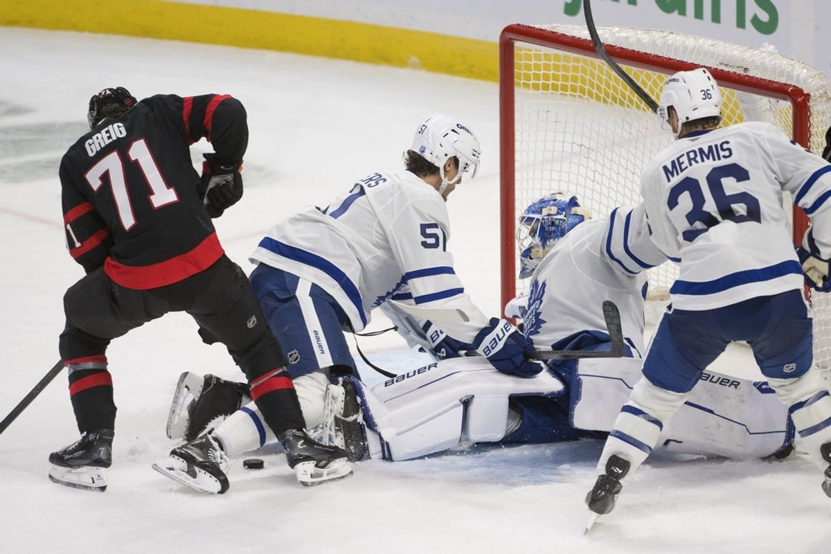 Sep 21st, 2025; Ottawa, Ontario, CAN; Toronto Maple Leafs goalie Artur Akhtyamov (70) loses sight of the puck following a shot by Ottawa Senators center Ridly Greig (71) in the third period at the Canadian Tire Centre. Mandatory Credit: Marc DesRosiers-IMAGN Images