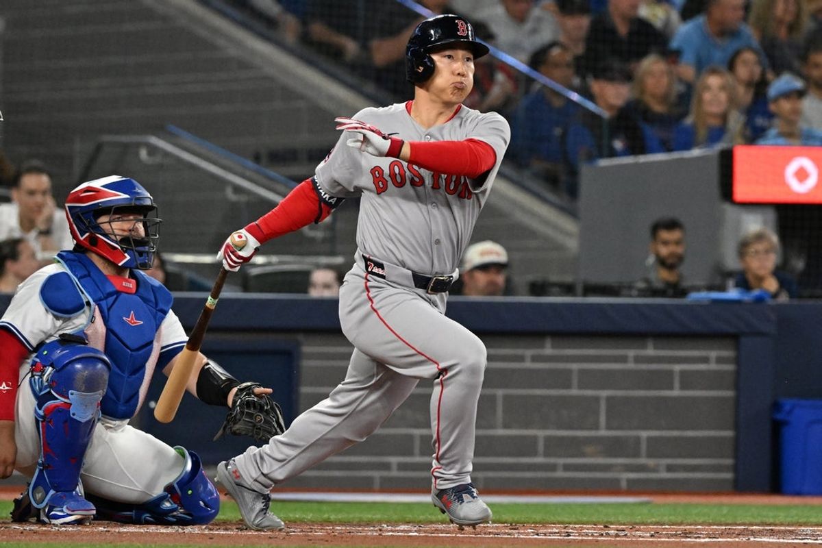 Sep 23, 2025; Toronto, Ontario, CAN;  Boston Red Sox designated hitter Masataka Yoshida (7) hits a double against the Toronto Blue Jays in the second inning at Rogers Centre. Mandatory Credit: Dan Hamilton-Imagn Images