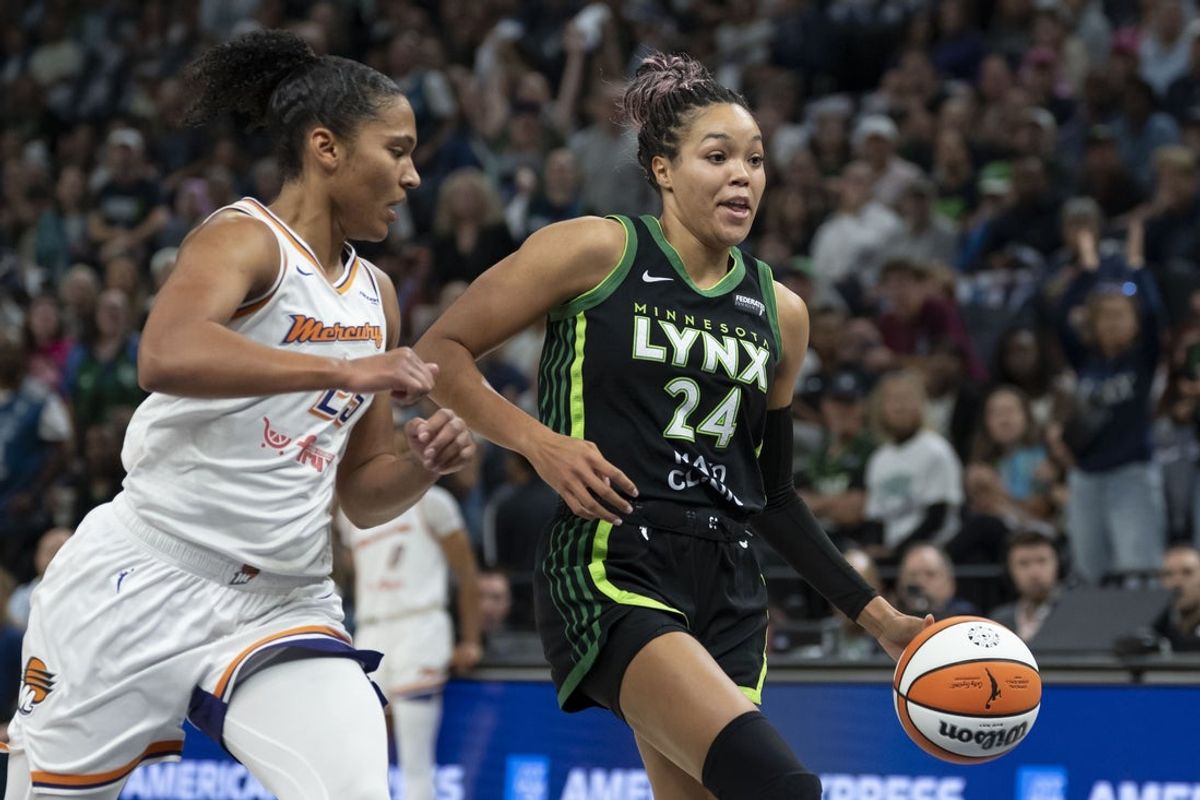 Sep 23, 2025; Minneapolis, Minnesota, USA; Minnesota Lynx forward Napheesa Collier (24) dribbles past Phoenix Mercury forward Alyssa Thomas (25) in the first half during game two of the second round for the 2025 WNBA Playoffs at Target Center. Mandatory Credit: Jesse Johnson-Imagn Images