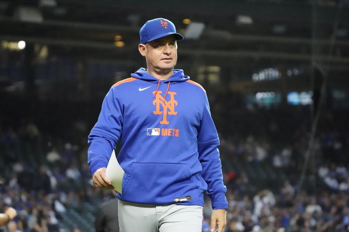 Sep 23, 2025; Chicago, Illinois, USA; New York Mets manager Carlos Mendoza (64) on the field before a game against the Chicago Cubs at Wrigley Field. Mandatory Credit: David Banks-Imagn Images