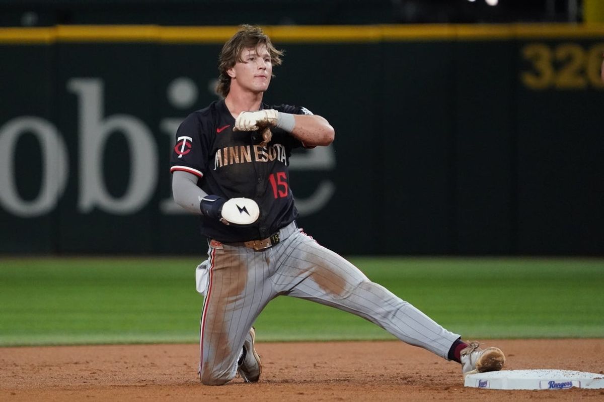 Sep 23, 2025; Arlington, Texas, USA; Minnesota Twins second baseman Luke Keaschall (15) keeps a foot on the base after stealing second during the second inning against the Texas Rangers at Globe Life Field. Mandatory Credit: Raymond Carlin III-Imagn Images