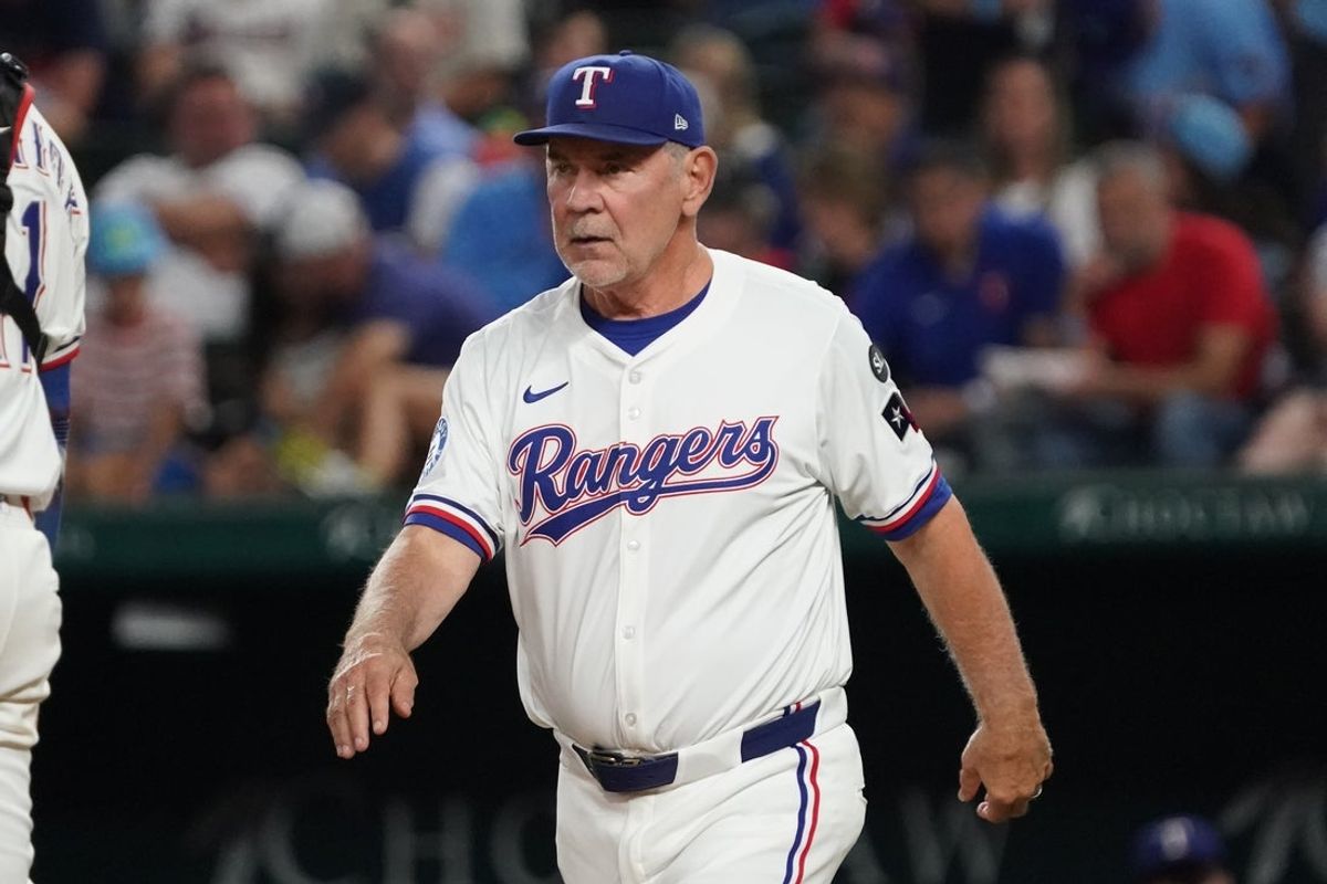 Sep 23, 2025; Arlington, Texas, USA; Texas Rangers manager Bruce Bochy (15) walks to the mound for a pitching change during the fourth inning against the Minnesota Twins at Globe Life Field. Mandatory Credit: Raymond Carlin III-Imagn Images