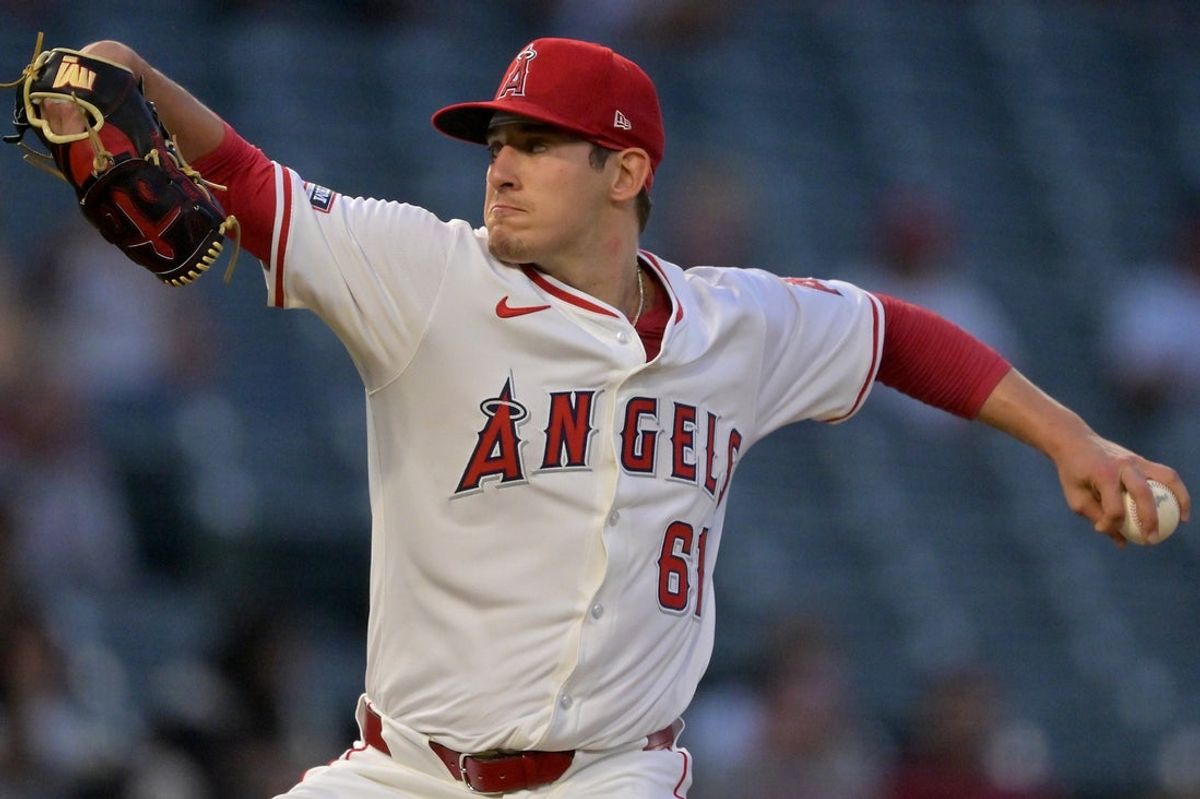 Sep 23, 2025; Anaheim, California, USA;  Los Angeles Angels starting pitcher Sam Aldegheri (61) delivers during the first inning against the Kansas City Royals at Angel Stadium. Mandatory Credit: Jayne Kamin-Oncea-Imagn Images