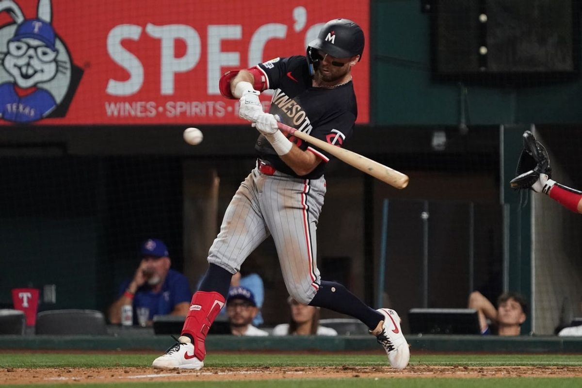 Sep 23, 2025; Arlington, Texas, USA; Minnesota Twins second baseman Kody Clemens (18) hits an RBI single during the sixth inning against the Texas Rangers at Globe Life Field. Mandatory Credit: Raymond Carlin III-Imagn Images