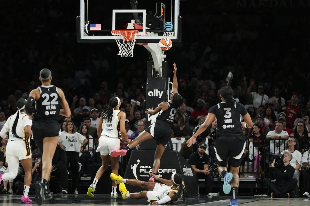 Sep 23, 2025; Las Vegas, Nevada, USA; Las Vegas Aces guard Jackie Young (0) shoots a layup against the Indiana Fever during the second quarter in game two of the second round for the 2025 WNBA Playoffs at Michelob Ultra Arena. Mandatory Credit: Lucas Peltier-Imagn Images