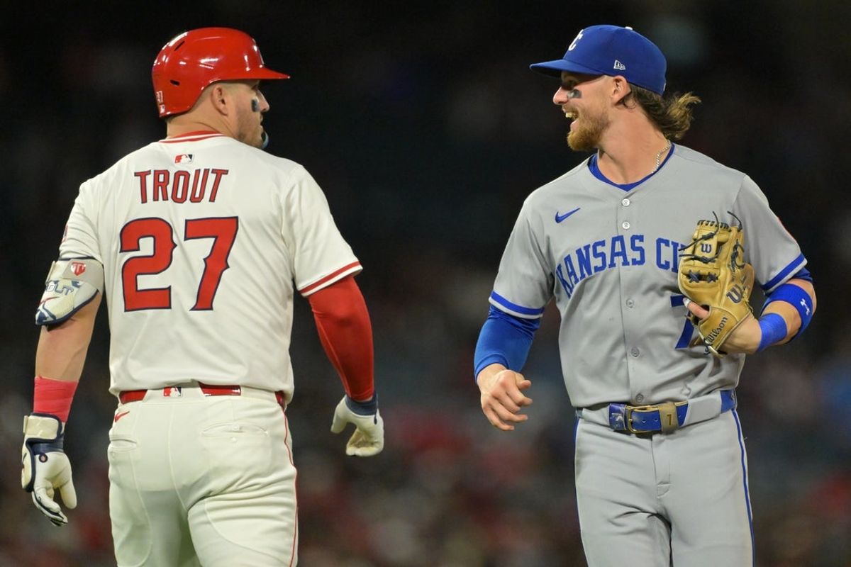 Sep 23, 2025; Anaheim, California, USA;  Los Angeles Angels designated hitter Mike Trout (27) and Kansas City Royals shortstop Bobby Witt Jr. (7) laugh as they pass each other after the fourth inning at Angel Stadium. Mandatory Credit: Jayne Kamin-Oncea-Imagn Images