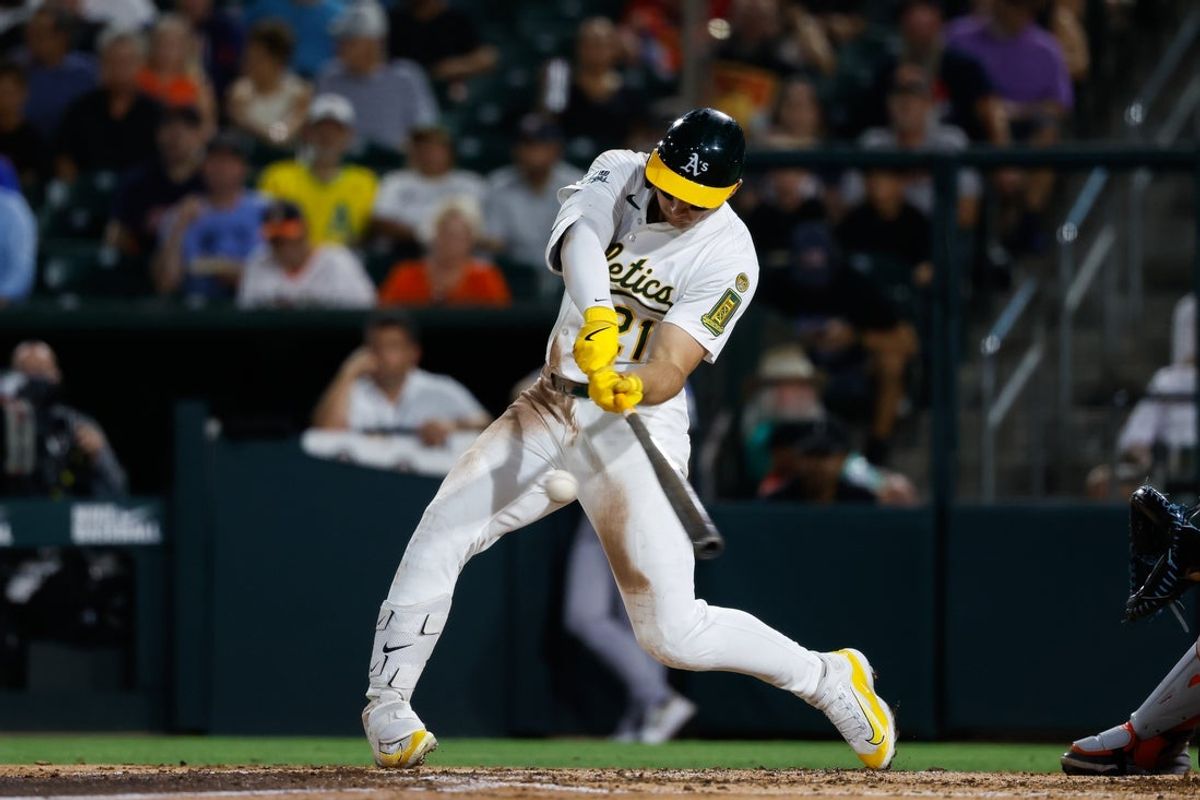 Sep 23, 2025; West Sacramento, California, USA; Athletics left fielder Tyler Soderstrom (21) hits a RBI double during the fifth inning against the Houston Astros at Sutter Health Park. Mandatory Credit: Sergio Estrada-Imagn Images