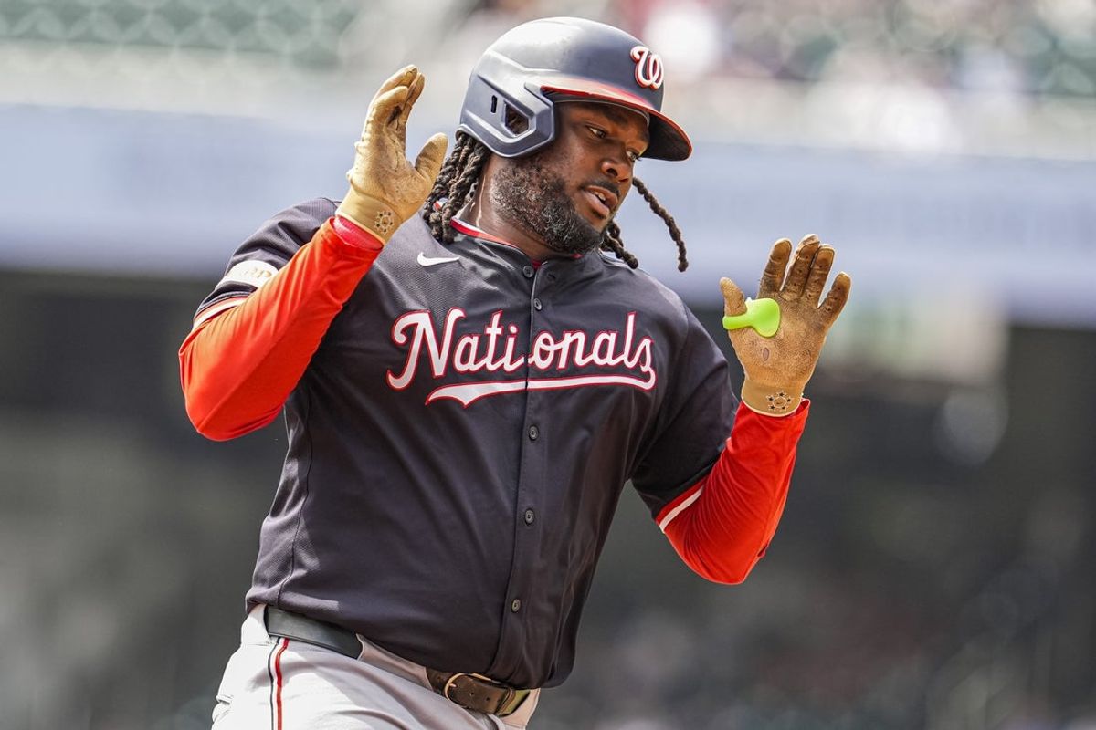 Sep 24, 2025; Cumberland, Georgia, USA; Washington Nationals first baseman Josh Bell (19) reacts after hitting a home run against the Atlanta Braves during the fourth inning at Truist Park. Mandatory Credit: Dale Zanine-Imagn Images