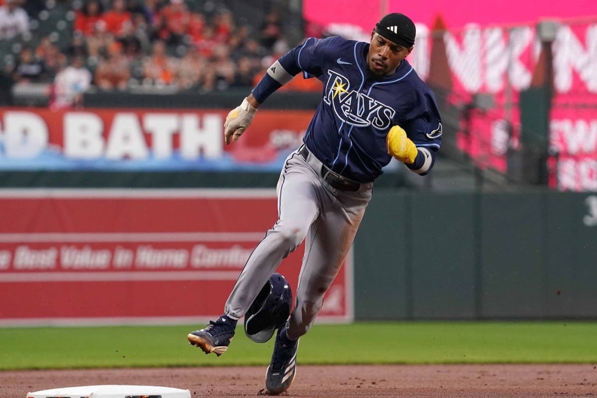 Sep 24, 2025; Baltimore, Maryland, USA; Tampa Bay Rays outfielder Chandler Simpson (14) rounds the bases to score during the first inning against the Baltimore Orioles at Oriole Park at Camden Yards. Mandatory Credit: Mitch Stringer-Imagn Images