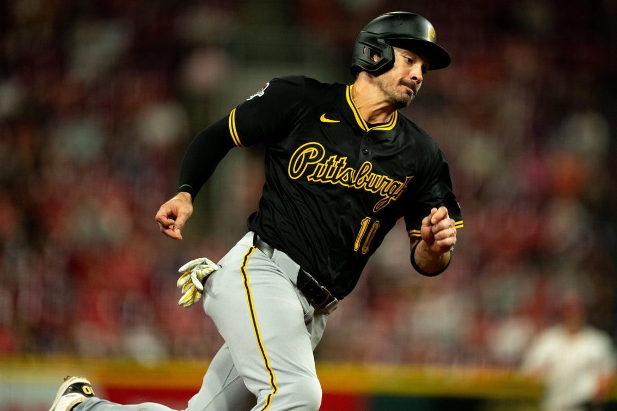 Pittsburg Pirates right fielder Bryan Reynolds (10) rounds third and scores on a base hit from Pittsburg Pirates first baseman Spencer Horwitz (2) in the sixth inning between Cincinnati Reds and Pittsburg Pirates at Great American Ball Park in Cincinnati on Sept. 24, 2025.