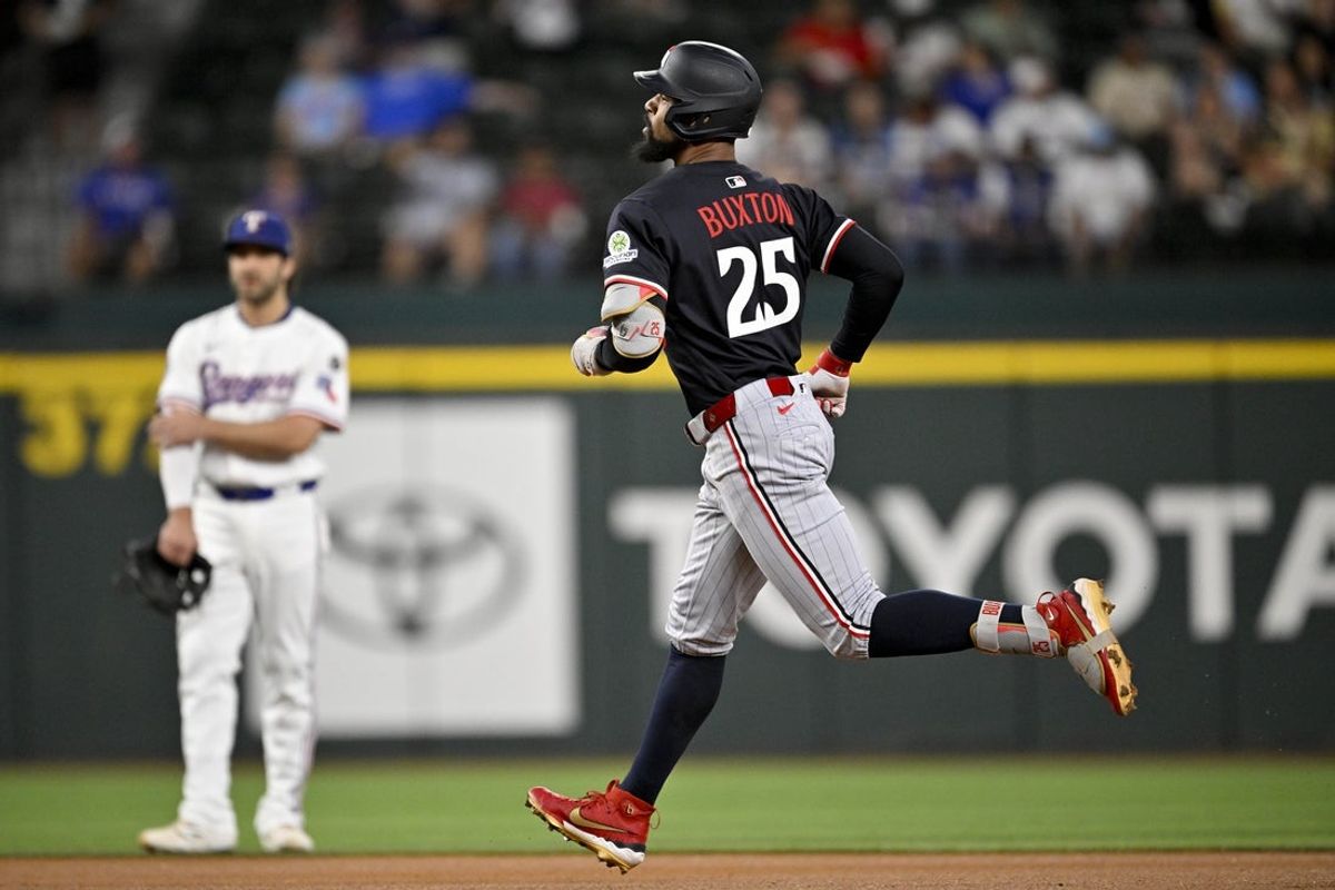 Sep 24, 2025; Arlington, Texas, USA; Minnesota Twins designated hitter Byron Buxton (25) rounds the bases after he hits a lead off home run during the first inning against the Texas Rangers at Globe Life Field. Mandatory Credit: Jerome Miron-Imagn Images