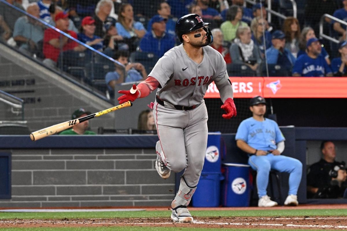 Sep 24, 2025; Toronto, Ontario, CAN;  Boston Red Sox catcher Carlos Narvaez (75) hits a three-run home run against the Toronto Blue Jays in the eighth inning at Rogers Centre. Mandatory Credit: Dan Hamilton-Imagn Images