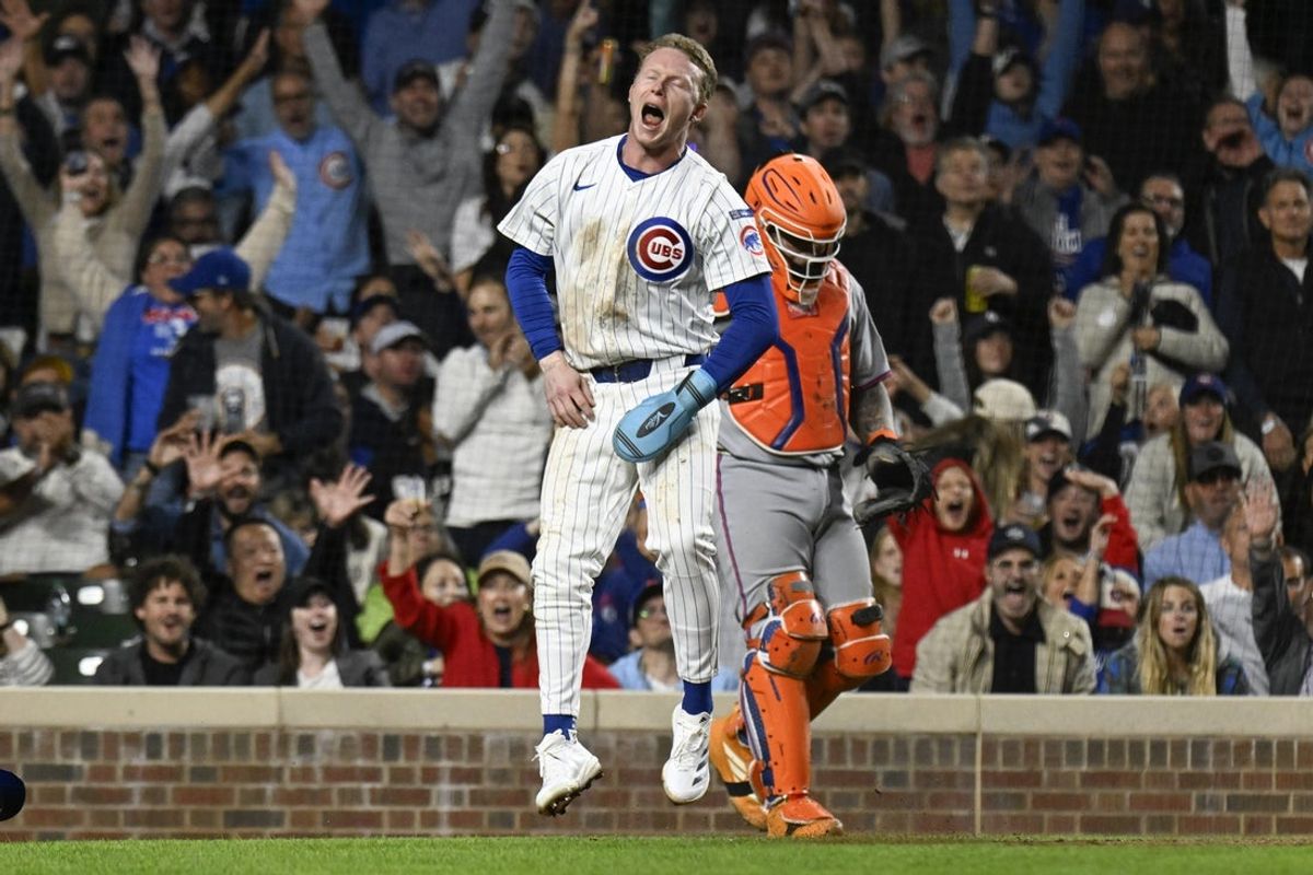 Sep 24, 2025; Chicago, Illinois, USA;   Chicago Cubs outfielder Pete Crow-Armstrong (4) reacts after scoring on a wild pitch thrown by New York Mets pitcher Clay Holmes (not pictured) during the fifth inning  at Wrigley Field. Mandatory Credit: Matt Marton-Imagn Images