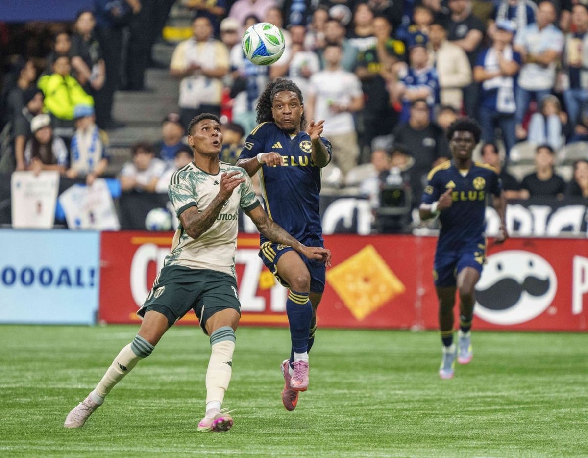 Sep 24, 2025; Vancouver, British Columbia, CAN;  Portland Timbers left wing Antony Alves Santos (11) (R) and    Vancouver Whitecaps FC midfielder Jayden Nelson (7) fight for position in the first half at BC Place. Mandatory Credit: Christopher Morris-Imagn Images