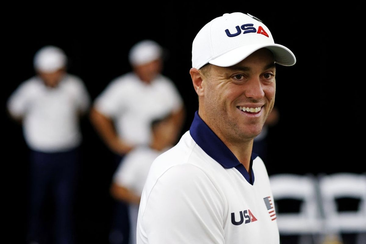 Sep 25, 2025; Bethpage, New York, USA; Justin Thomas laughs during the team portrait before a practice round of the Ryder Cup golf tournament at Bethpage Black. Mandatory Credit: Peter Casey-Imagn Images