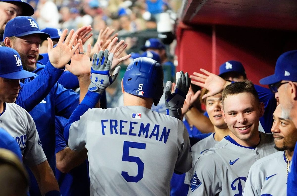 Los Angeles Dodgers Freddie Freeman (5) reacts after hitting a home run against the Arizona Diamondbacks in the second inning during the season home finale at Chase Field in Phoenix on Sept. 25, 2025.