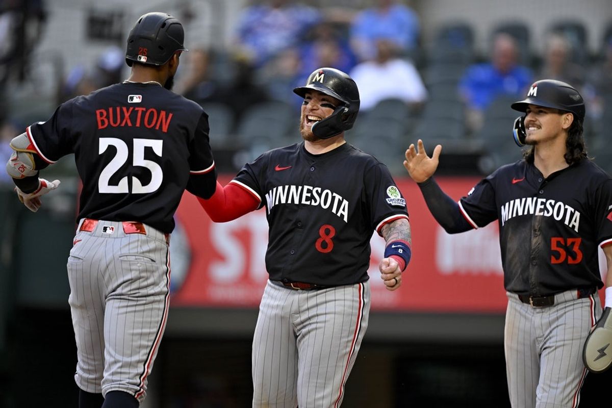 Sep 25, 2025; Arlington, Texas, USA; Minnesota Twins center fielder Byron Buxton (25) and catcher Christian Vazquez (8) and third baseman Ryan Fitzgerald (53) celebrate after Buxton hits a three run home run against the Texas Rangers during the eighth inning at Globe Life Field. Mandatory Credit: Jerome Miron-Imagn Images