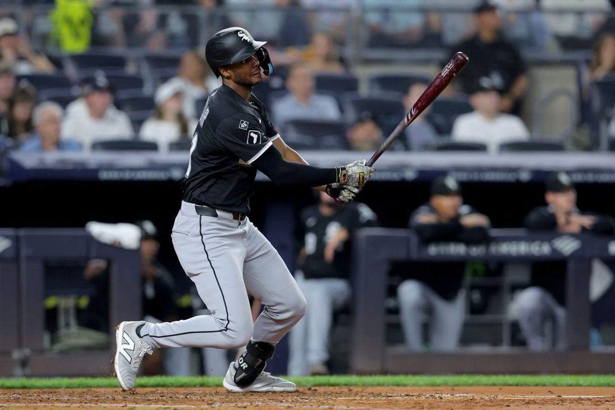 Sep 25, 2025; Bronx, New York, USA; Chicago White Sox right fielder Michael A. Taylor (21) follows through on a two run home run against the New York Yankees during the fourth inning at Yankee Stadium. Mandatory Credit: Brad Penner-Imagn Images