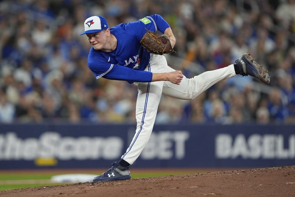 Sep 25, 2025; Toronto, Ontario, CAN; Toronto Blue Jays starting pitcher Louie Varland (77) pitches to the Boston Red Sox during the second inning at Rogers Centre. Mandatory Credit: John E. Sokolowski-Imagn Images