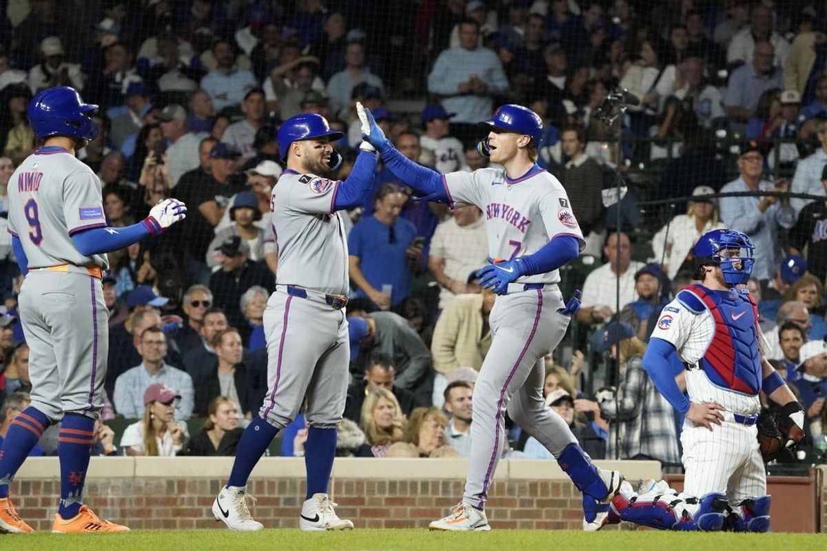 Sep 25, 2025; Chicago, Illinois, USA; New York Mets third base Brett Baty (7) is greeted by catcher Luis Torrens (13) after hitting a three-run home run against the Chicago Cubs during the fourth inning at Wrigley Field. Mandatory Credit: David Banks-Imagn Images